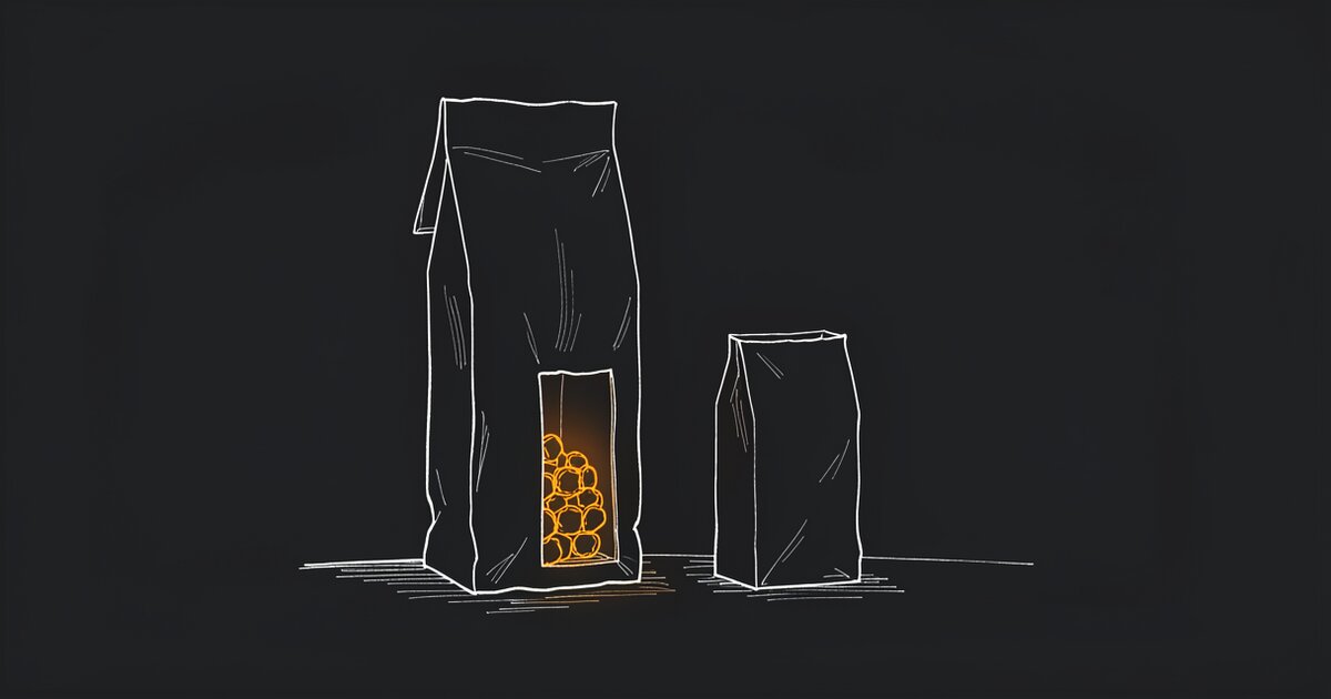 Line drawing of two upright sacks on a dark floor. A window in the taller one shows a cluster of orange cells inside it; the smaller sack beside it is unlit.